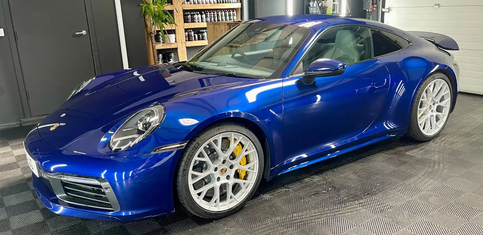 Blue Porsche with high-gloss finish