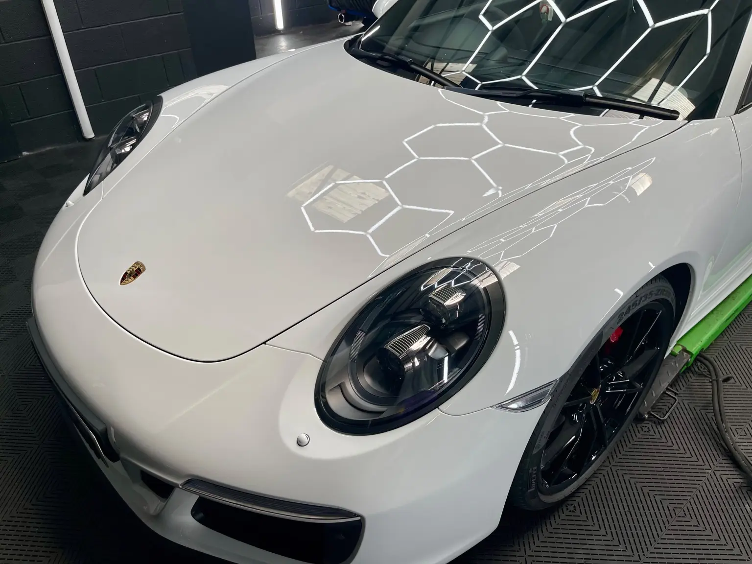 White Porsche inside the NME Detailing workshop